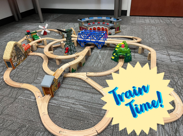 Photo of wooden toy train set and text 